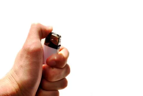 Hand with lighter on the isolated background Stock Photos