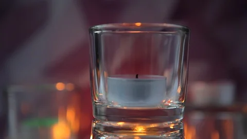 Hand with a lighter lights candles Stock Footage 91510141
