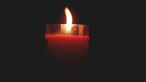 Hand Lighting Candle Flame in the Dark Stock Footage 348116316
