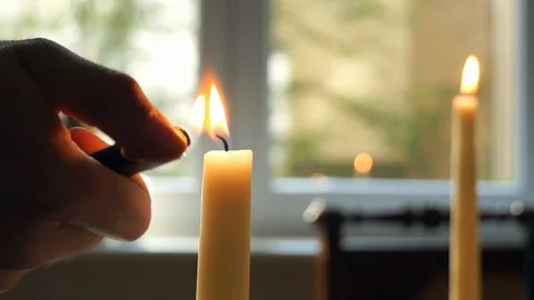 Hand lighting candle Stock Footage