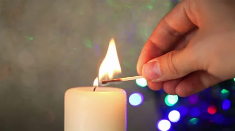 Hand lighting christmas candle Stock-Footage 30700256