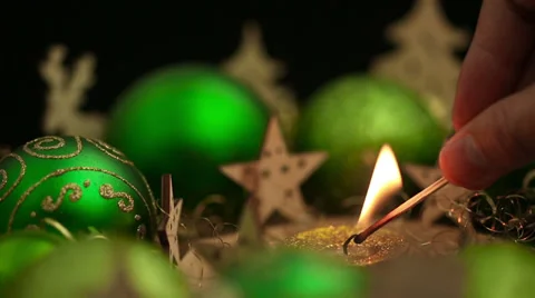 Hand lighting christmas candle in a loop Stock Footage 30967761