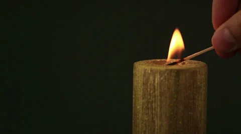 Hand lighting christmas candle with match Stock Footage 30957741