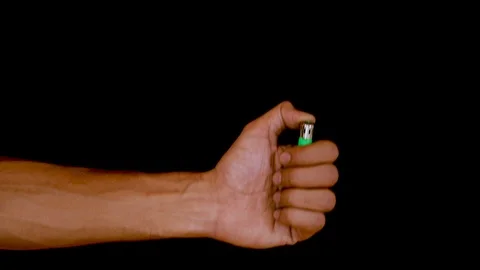 Hand lighting a cigarette lighter. Stock Footage 120943853