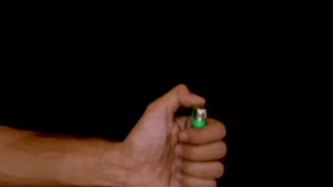 Hand lighting a cigarette lighter. Stock Footage 120943994