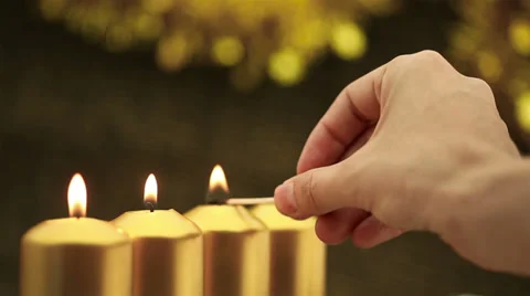 Hand lighting four advent candles Video stock 30704299