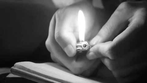Hand Lighting a Lighter in Low Light with Dramatic Shadows Stock Footage 333530462