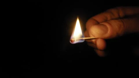 Hand Lighting A Match In Complete Darkness Stock Footage 324993928