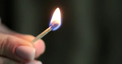 Hand lighting match with fire closeup 4k movie slow motion Stock-Footage 232708355