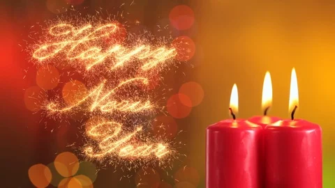 Hand lighting three red candles. Sparklers letters writing happy new year. Stock Footage 121321109