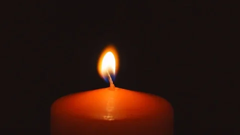 Hand lights a candle 動画素材 77284357