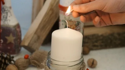 The hand lights the candle Stock Footage 113463356