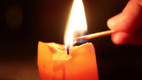 Hand Lights a Candle With a Match Stock Footage 281166538