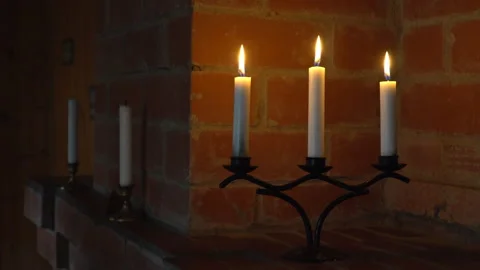 Hand lights candles with a match Stock Footage 136633163