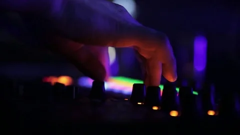 Hand on lights controller- disco Stock Footage 74831352