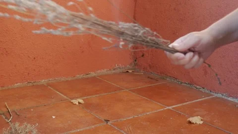 Hand Lights Dry Twigs With Match On Tiled Outdoor Corner Floor Stock Footage 336482139