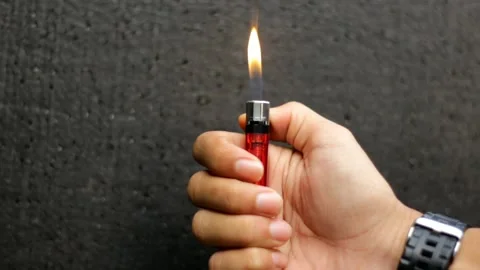 The hand that lights a gas lighter Stock Footage