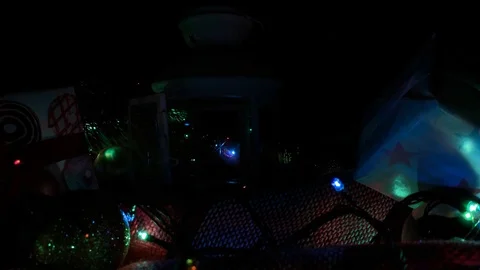 Hand lights new year fire. Beautiful presents under the Christmas tree. New Year Stock Footage 115600343