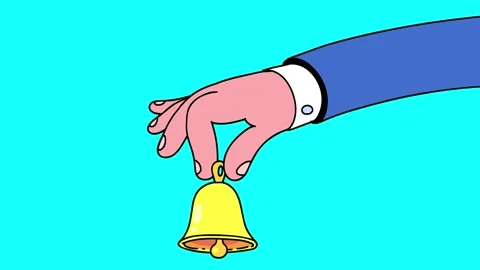 Hand with little golden yellow bell Stock Video Pond5