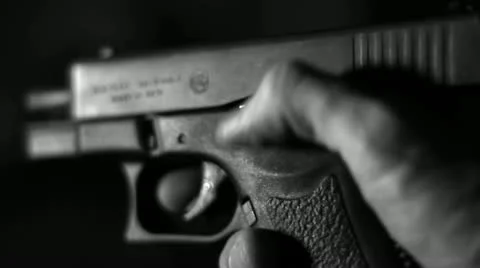 Hand locks a gun bolt Stock Footage 18348175