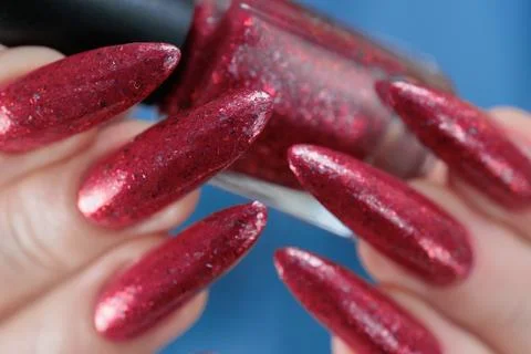 Hand with long nails and bright blue manicure Stock Photos