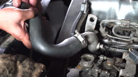 Hand machanic in put upper radiator hose at engine.technician repairing cooling  Video stock 183407228
