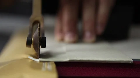 Hand made artistry, gold application via roller [shallow depth of field] Stock Footage 35827751
