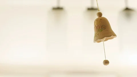 Hand made ceramic bell hanging day light on background wedding decoration couple 스톡 동영상 89773624