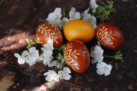 Hand made decorate Easter eggs on the dark table Stock Photos