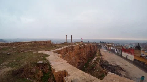 Hand-Made Ditch of Urfa Castle Divides Ruins and Slum Far Two Columns Bird Stock Footage 75410801