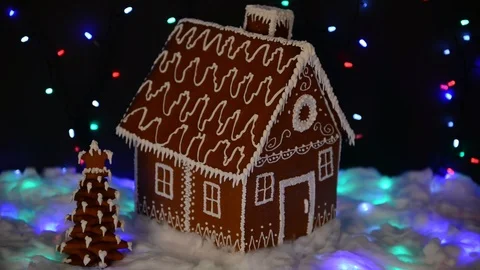 The hand-made eatable gingerbread house, New Year tree, snow decoration Video stock 114440939