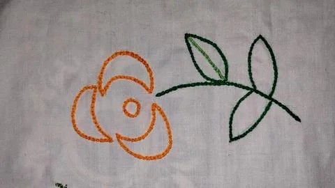 Hand made embraided flower with leaf Stock Photos