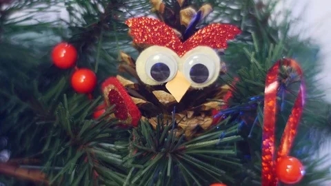 Hand Made Owl From a Pine Cone and a Festive Photo Frame Are Hanging on Twigs Stock Footage 72874122