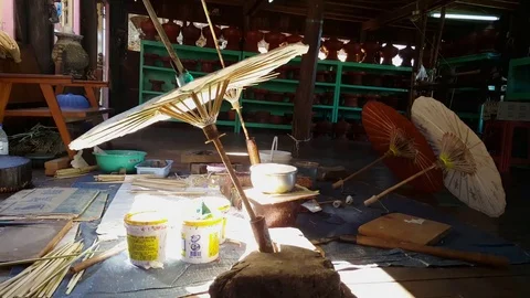 Hand made paper umbrellas set to dry on floor in workshop, Inle Lake, Myanmar Stockbeeldmateriaal 79834614