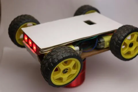 Hand made robot working on IOT platform. Mobile phone controlled robotic car Stock Photos