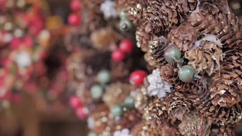 Hand made rustic wreath made of pine cones and berries. New year's decorations Stock Footage 305748469