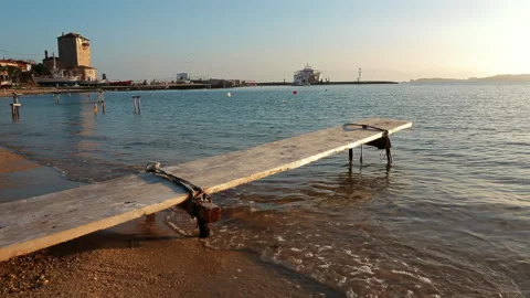 A hand-made small pier made of wood against the backdrop of the sea. Video stock 247467365