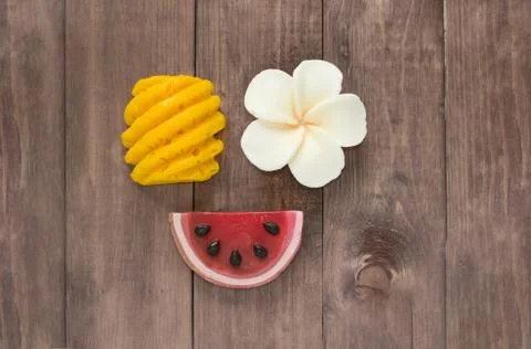Hand made soap in the shape of fruit yellow pineapple, watermelon and flower Stock Photos