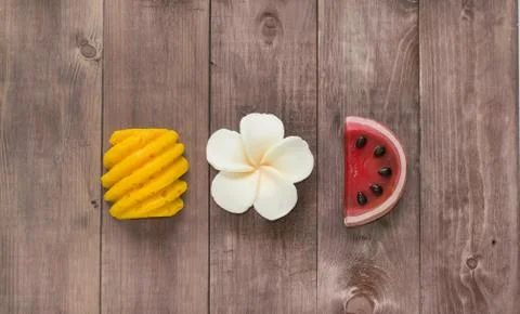 Hand made soap in the shape of fruit yellow pineapple, watermelon and flower Stock Photos