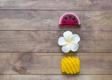Hand made soap in the shape of fruit yellow pineapple, watermelon and flower Stock Photos