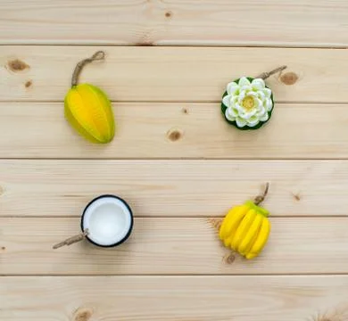 Hand made soap in the shape of tropic fruits mini bananas, carambola, flower  Stock Photos