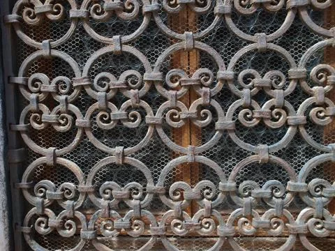 Hand made solid iron grille in the window Stock Photos