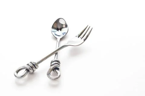 Hand made spoon and fork  stainless steel in modern style on white paper 스톡 사진