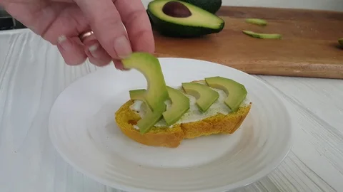 Hand make an avocado sandwich Stock Footage 86855709