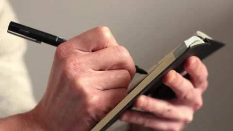 Hand makes notes in a notebook Stock Footage 252532718