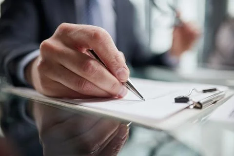 Hand makes notes on a paper notebook, close-up Stock Photos