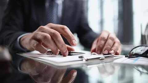 Hand makes notes on a paper notebook, close-up Stock Photos