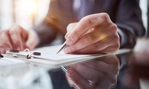 Hand makes notes on a paper notebook, close-up Foto stock