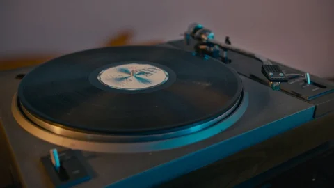 A hand makes the record player start Video stock 128424786
