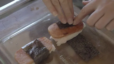Hand makes spam masubi Stock Footage 246454305
